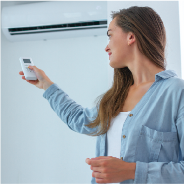 woman using air conditioner