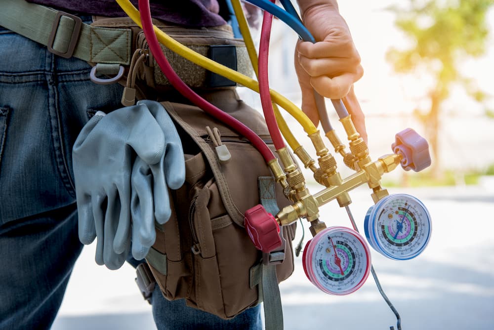 HVAC technician holding tools used for HVAC repair in Twin Falls, ID.
