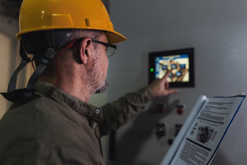 Technician using smart thermostat.