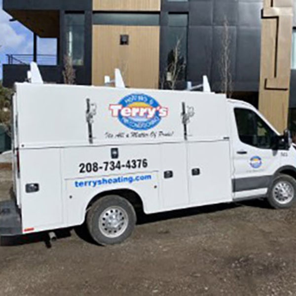 Terry’s work truck sitting outside residential home to work on dual-fuel system