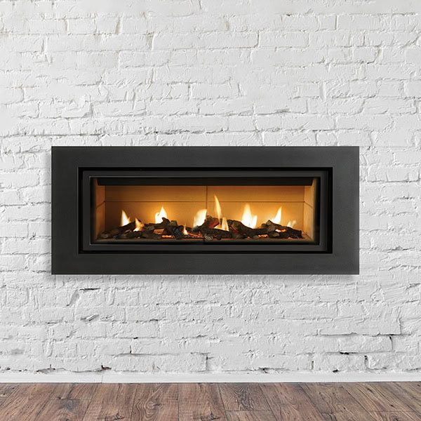 A modern gas fireplace set against a white brick wall, showcasing a sleek and contemporary design.