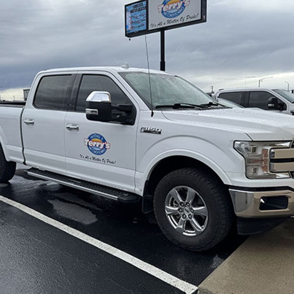 Heat Pump 1_600x600 A white Ford F-150 pickup truck parked in front of Terry's Heating & Air Conditioning.