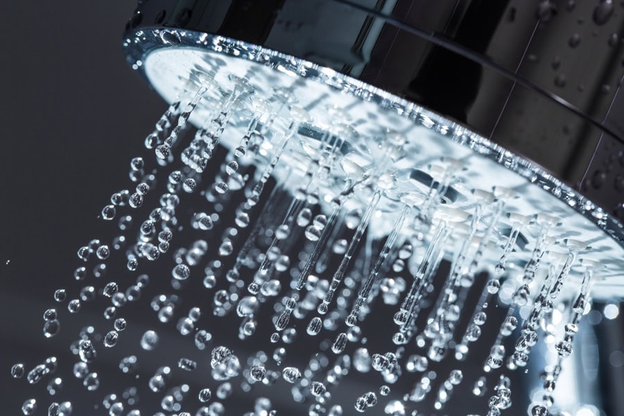 Showerhead with full stream of water thanks to a tankless water heater.